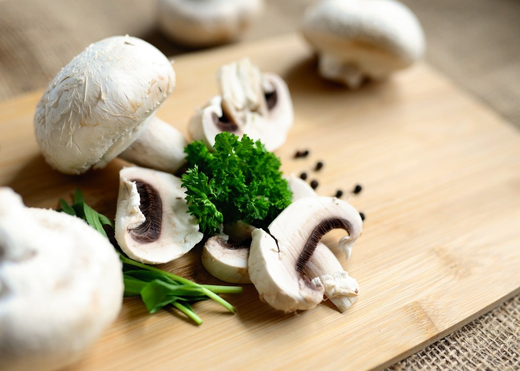 Whole and sliced mushrooms